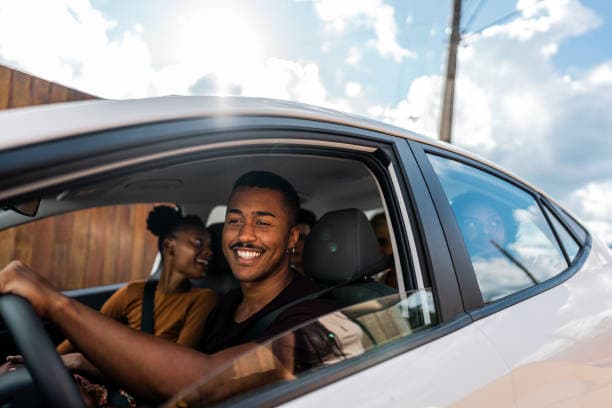 A driver and passenger riding together in a car